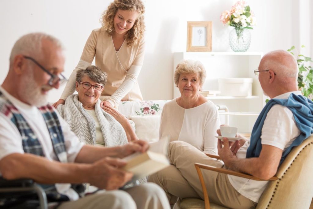 nurse with a group of seniors finding a memory care facility