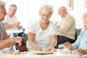 old lady playing a game as a part of a recreational program for seniors