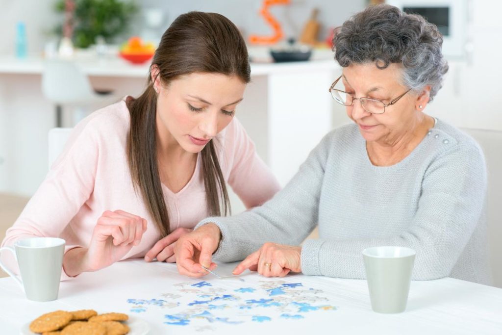 nurse helping resident by providing services in assisted living