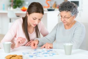 nurse helping resident by providing services in assisted living