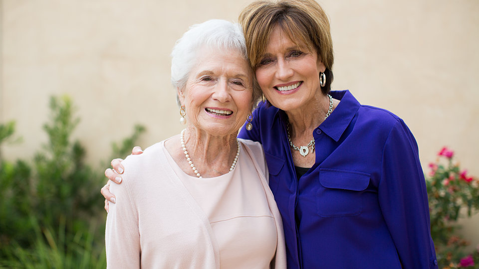 senior woman smiling with older woman