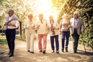 people walking down a sidewalk during one of many Group Outings for Seniors