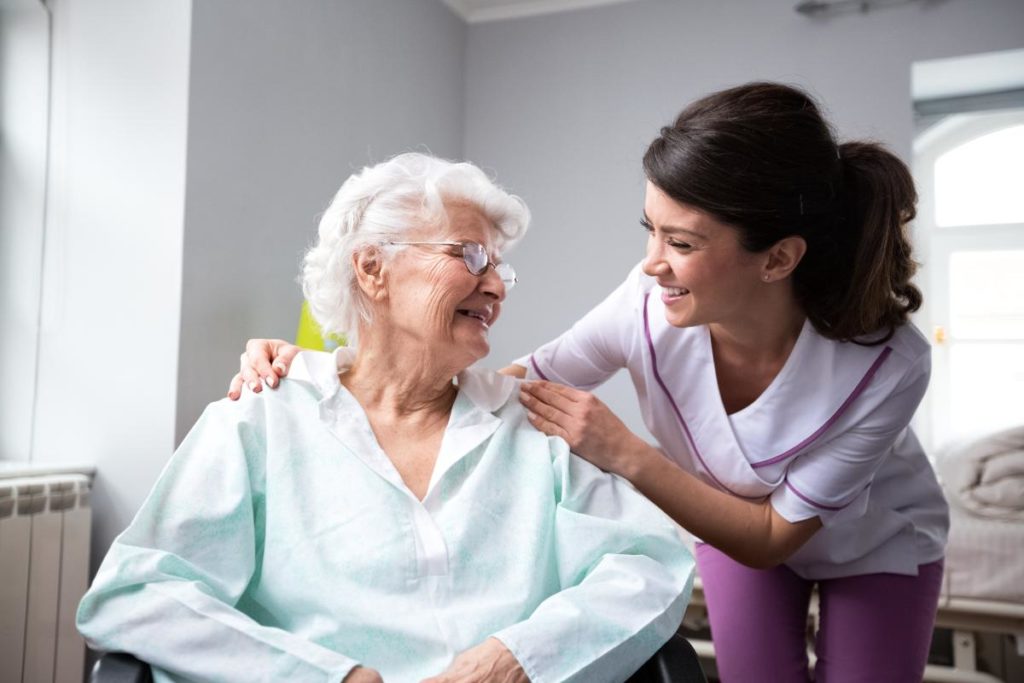 an elderly person and a nurse talk possibly about the respite care cost