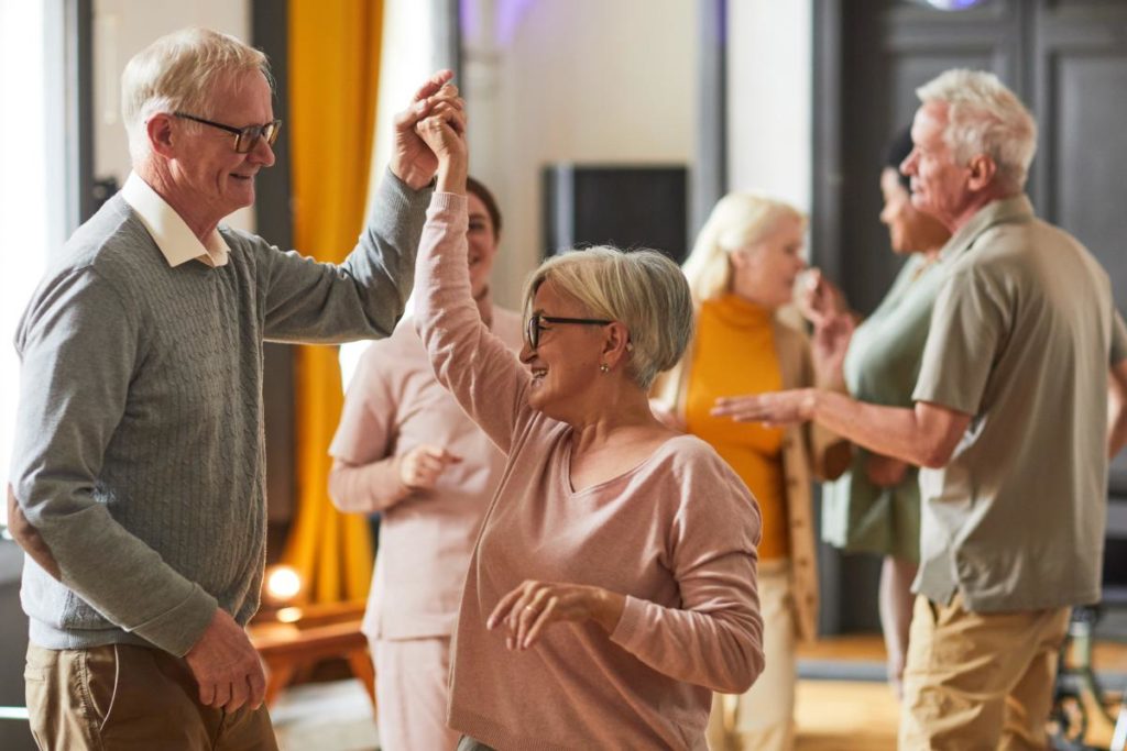 a group dances one of the Community activities for seniors