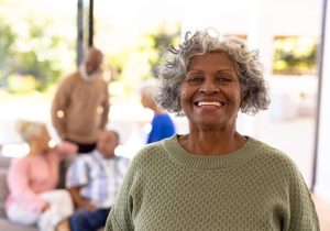 a senior smiles during Respite Care Services