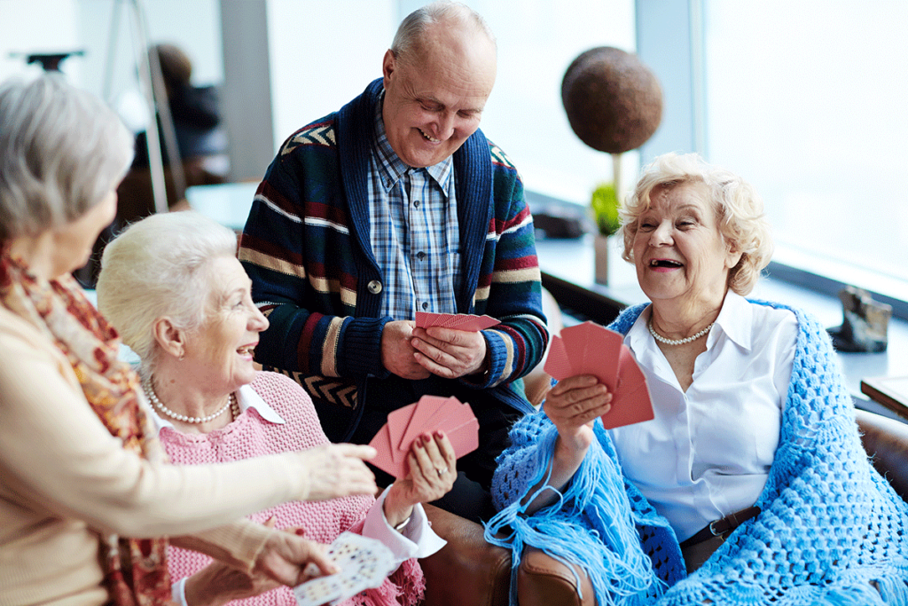 a group enjoying Senior Independent living plays cards