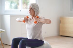 Person trying out strength and flexibility exercises for the elderly