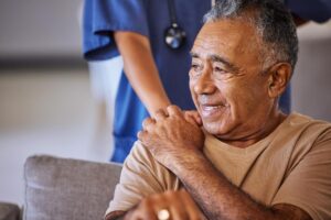 person smiling with caretaker after discussing how often can you use respite care