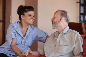 A senior and a staff member discuss the transition to assisted living
