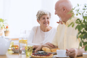 seniors enjoying breakfast together while discussing misconceptions about seniors and diet