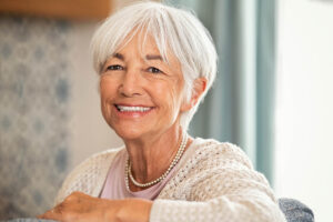 senior woman smiling after learning how memory care enhances quality of life