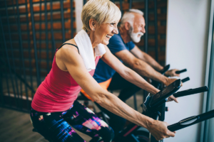 seniors on exercise bikes after finding out about senior fitness programs in austin